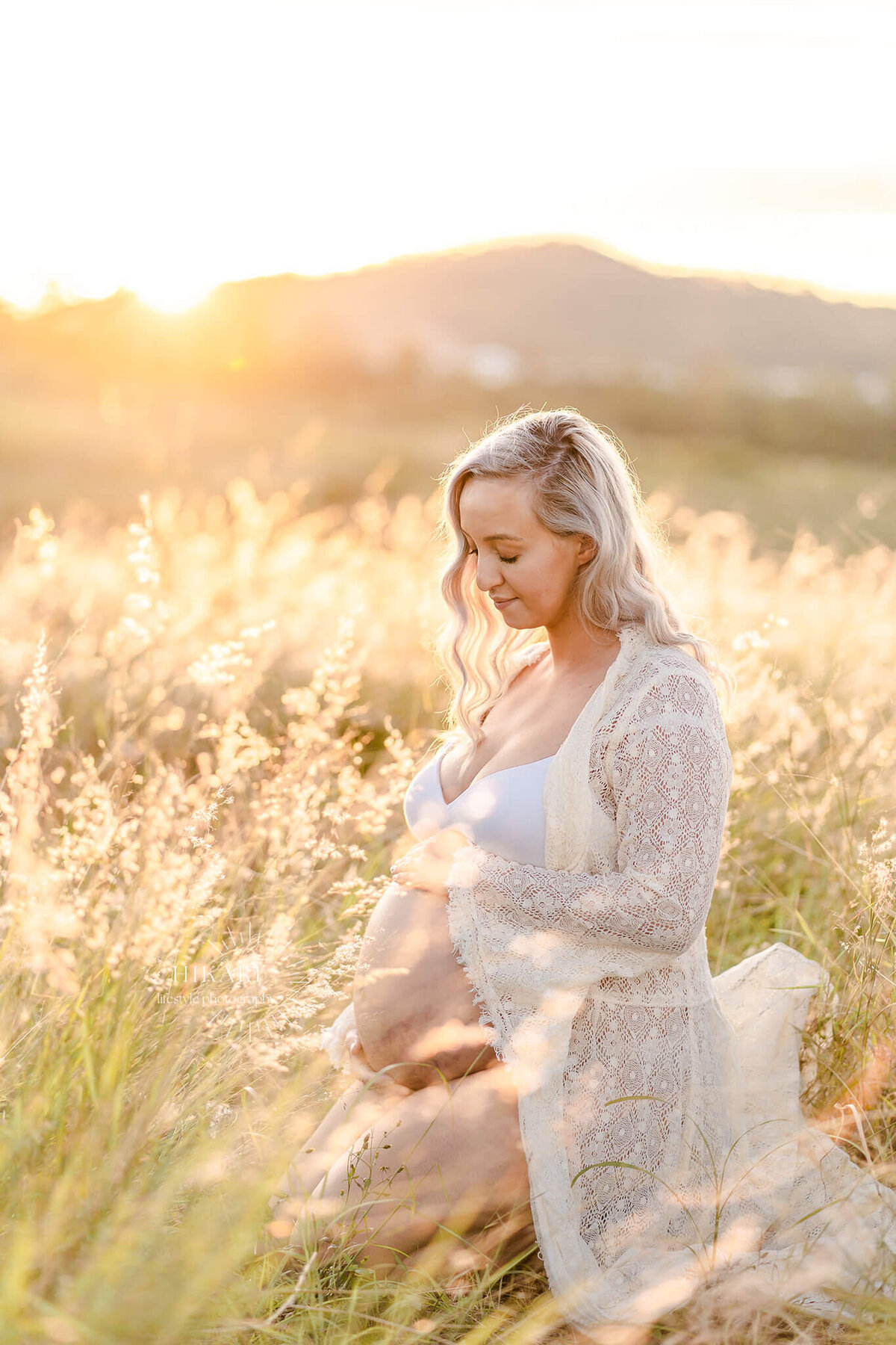 beautiful willow grassy field in gold coast hinterlands for private maternity photo session candid and relaxed.