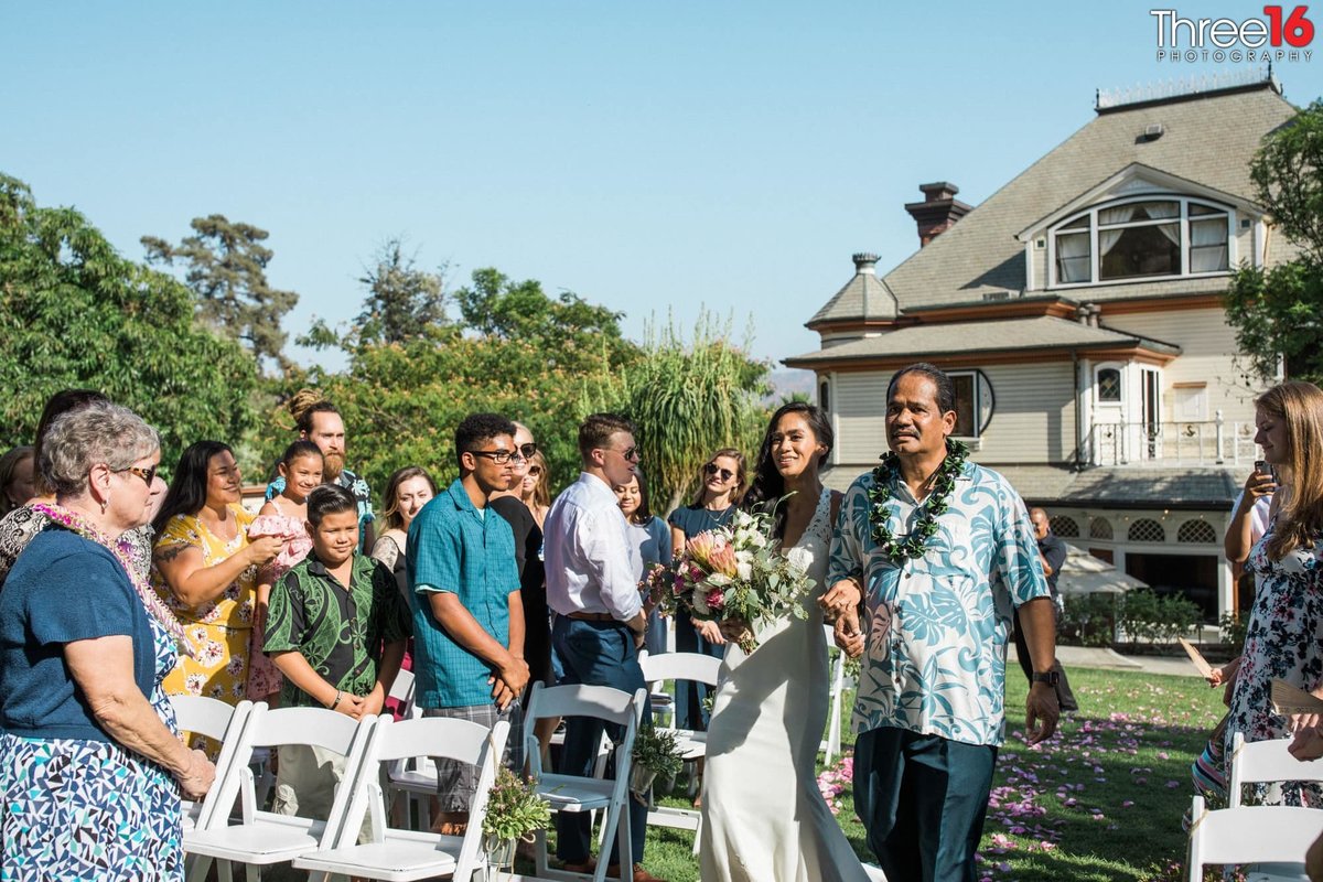 Father escorts his daughter down the aisle