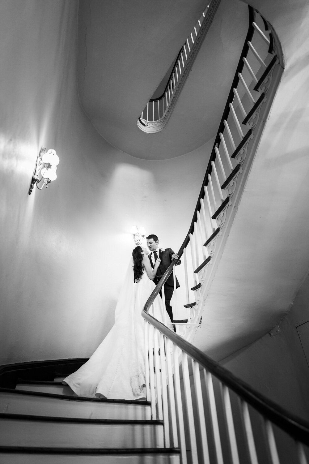 Bride and groom on stairs