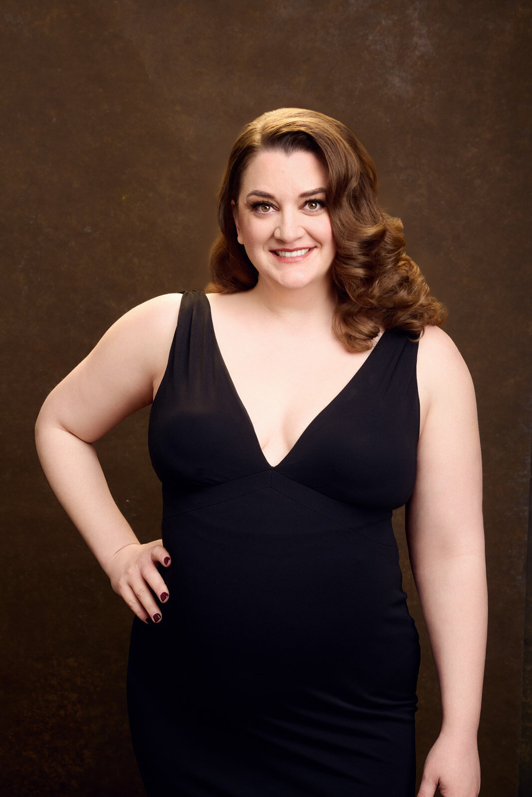 Elegant Woman in Black Dress Posing with a Confident Smile-49