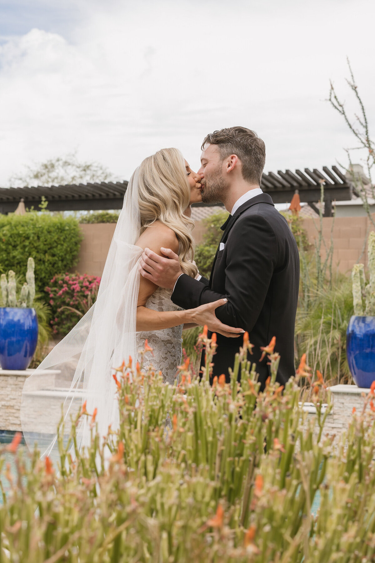 Bride and groom kissing during first look in Scottsdale, Arizona