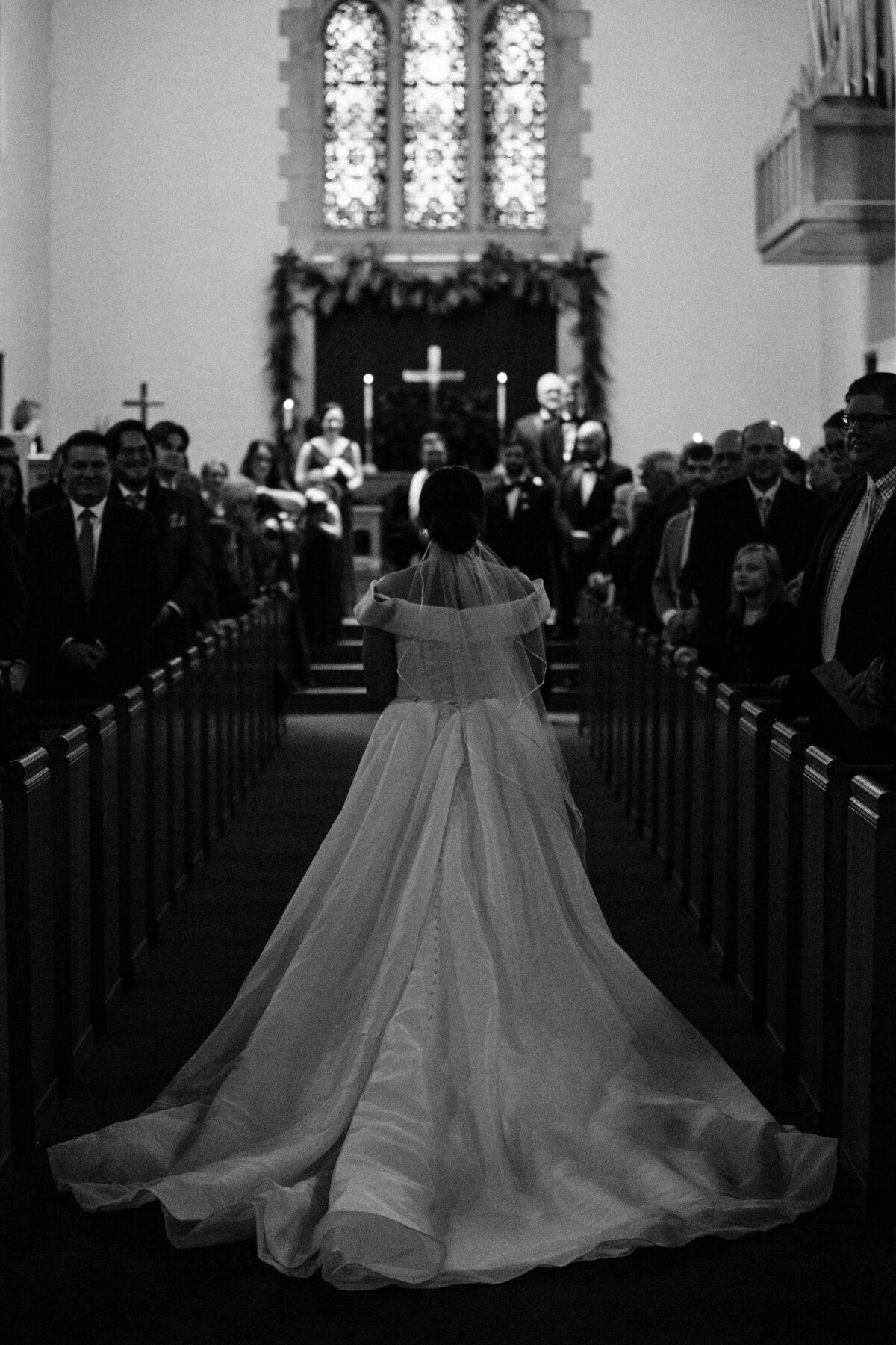 Bride walking down the aisle of church