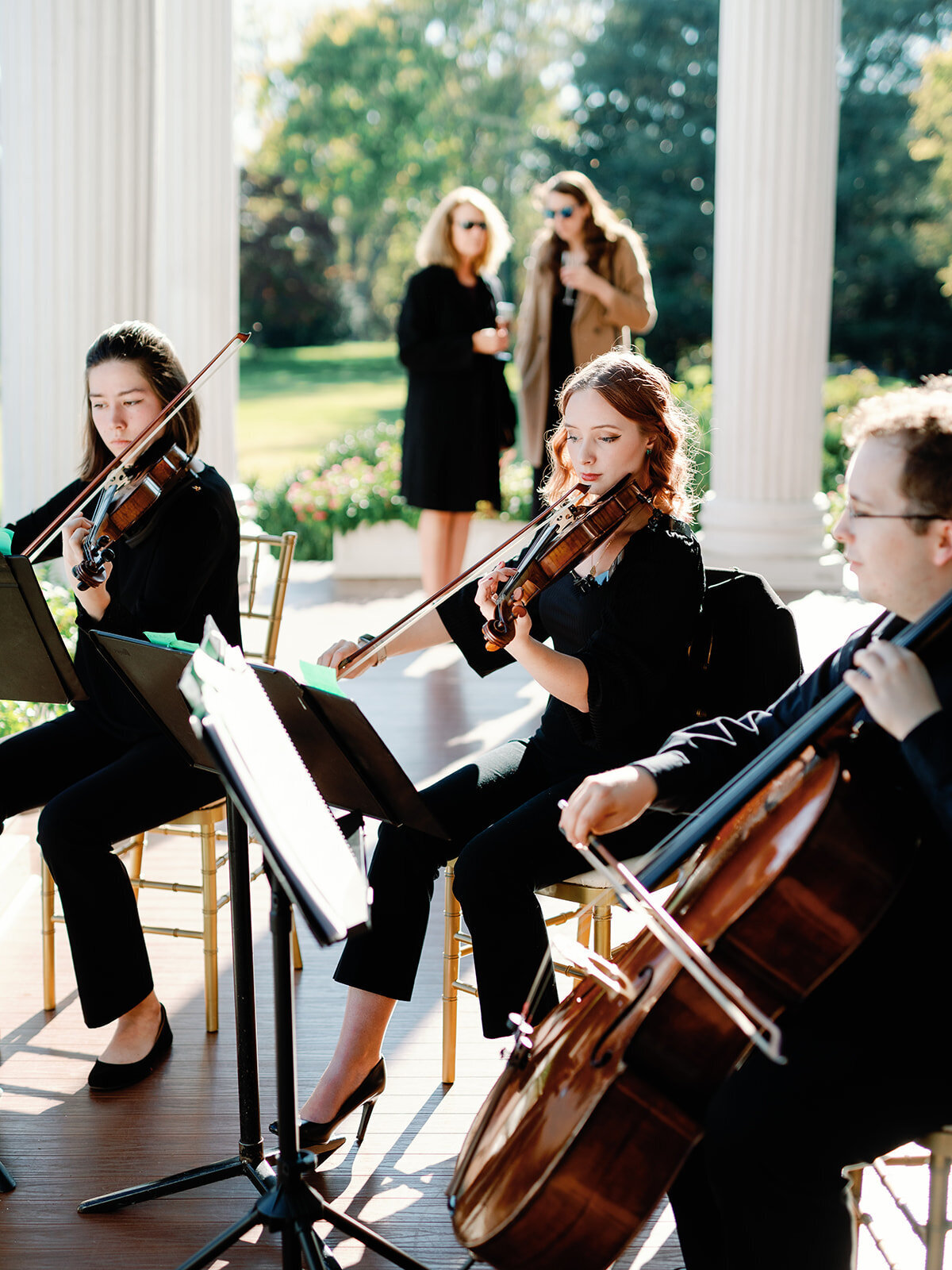 Musicians at manor portico space before the ceremony