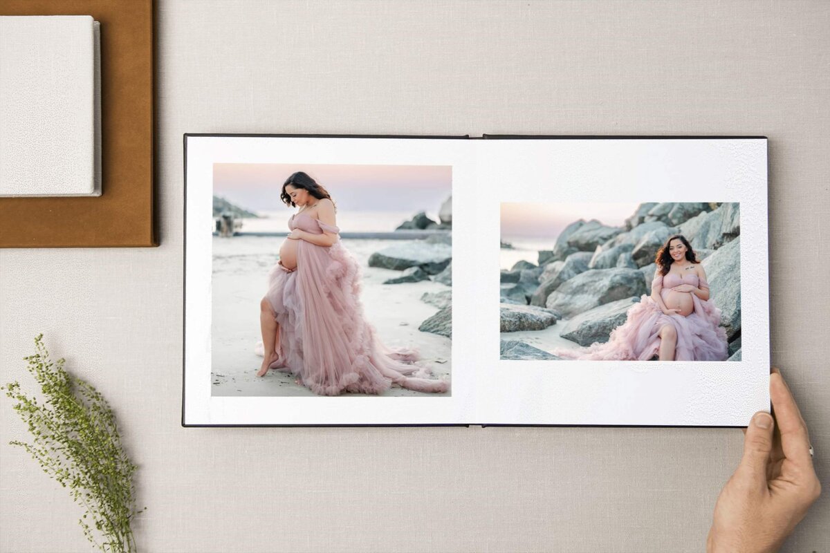 An example of an album that can be purchased through Justine Renee Photography's print store. The album features a pregnant woman wearing  a pink tulle dress on the beach.