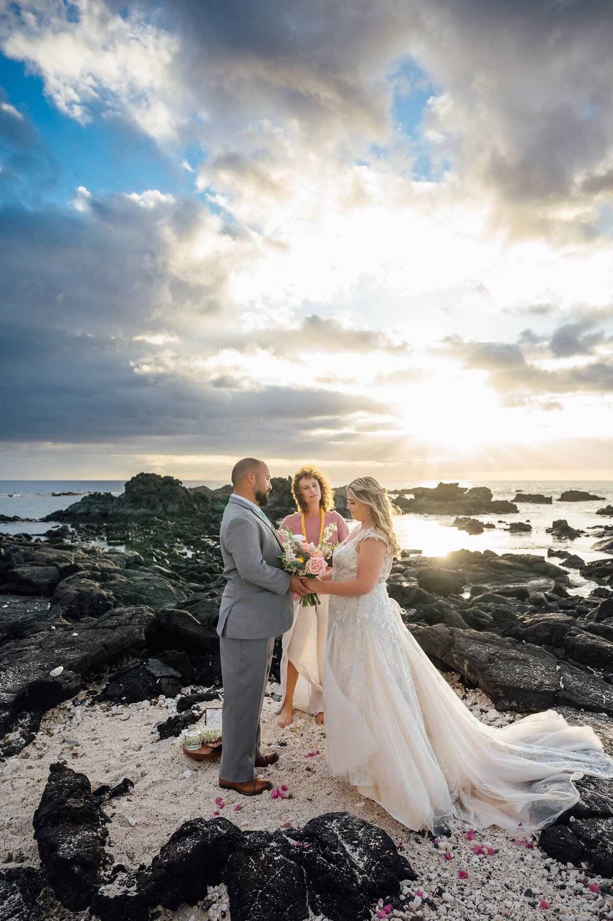 cloudy sunset wedding in hawaii on the beach