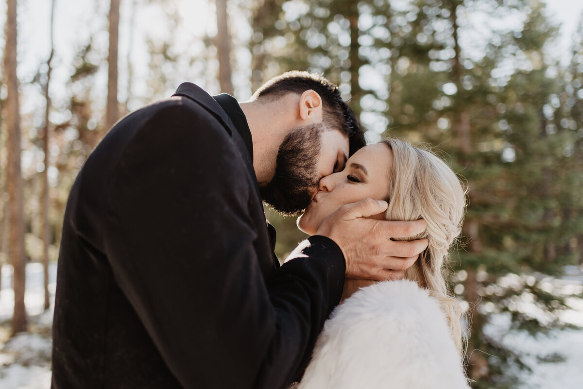 Jackson Hole Photographers capture bride and groom kiss after winter elopement