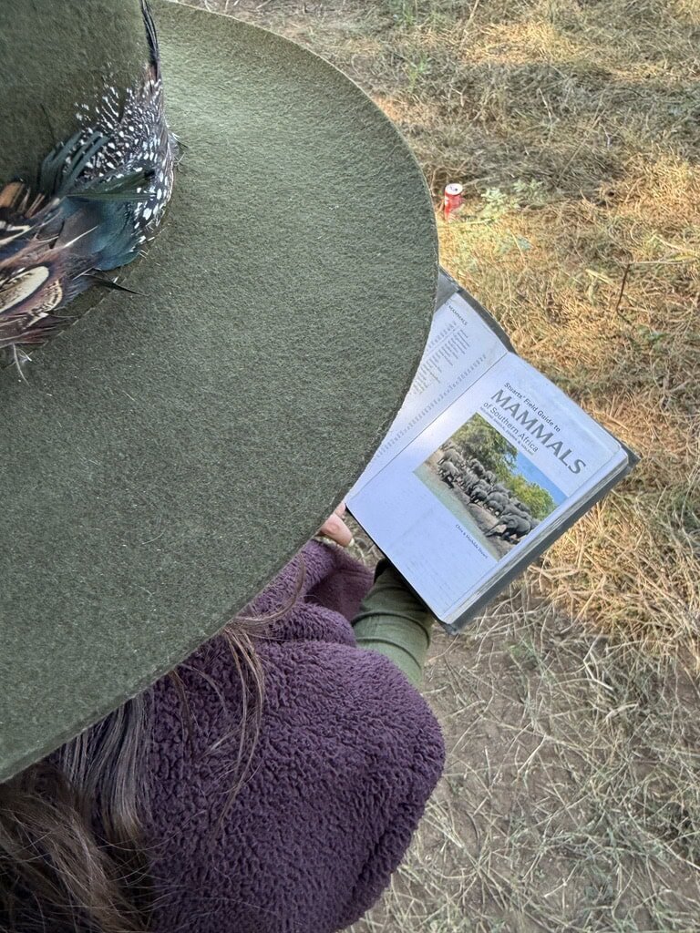 Woman reading a book on mammals