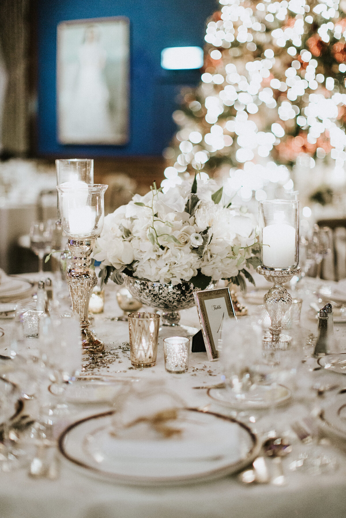 All white wedding centerpiece on tabletop