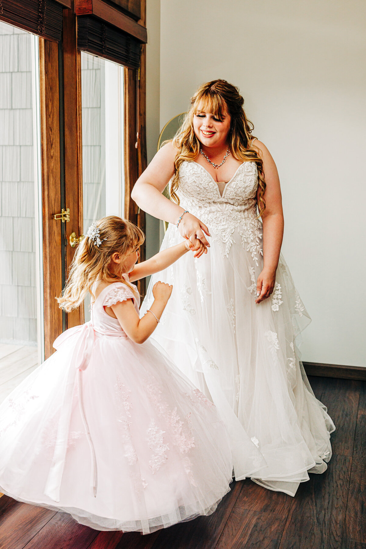 Bride dancing with daughter at Kwataqnuk Resort in Polson, MT