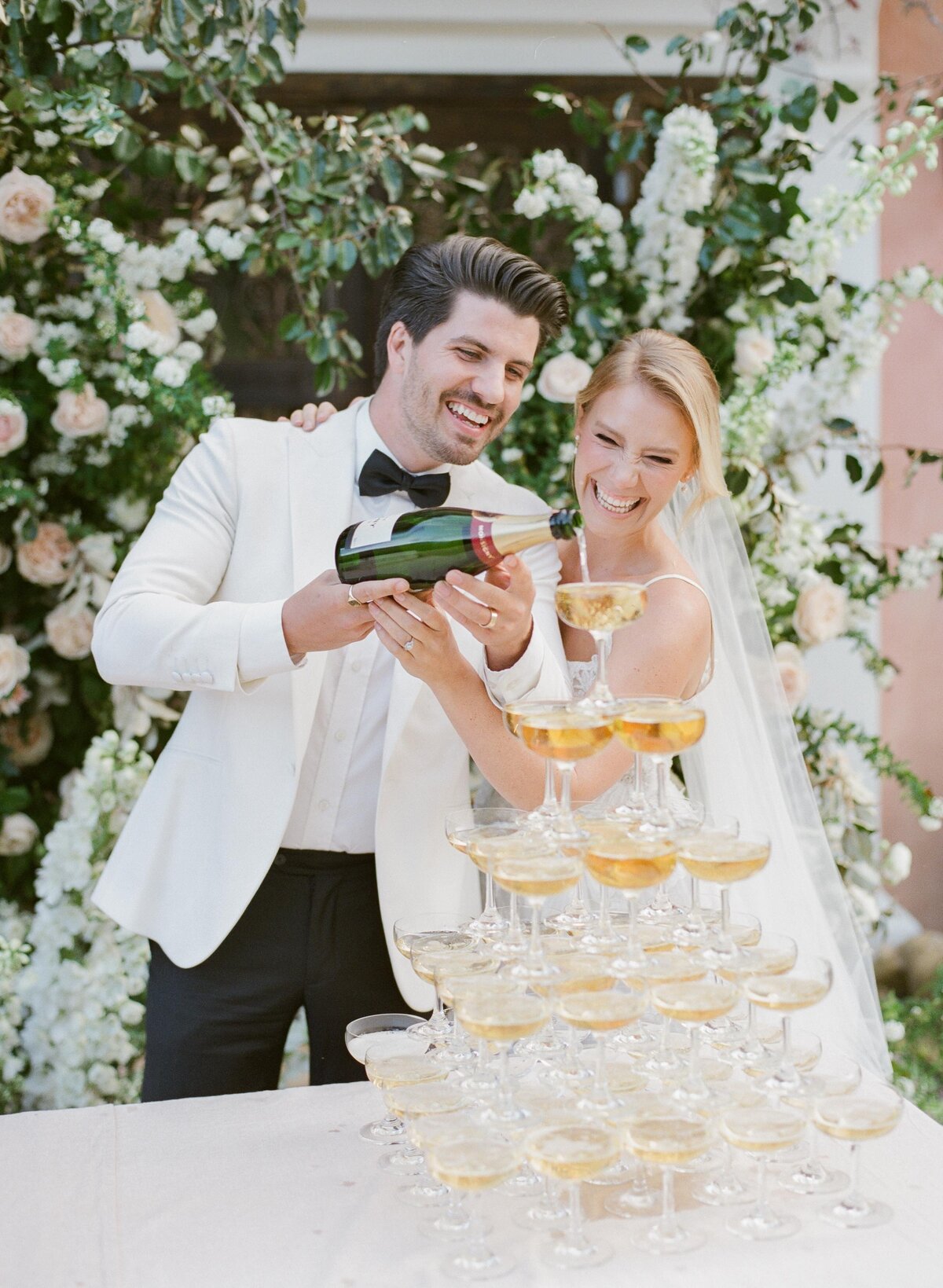 happy bride + groom + champagne tower