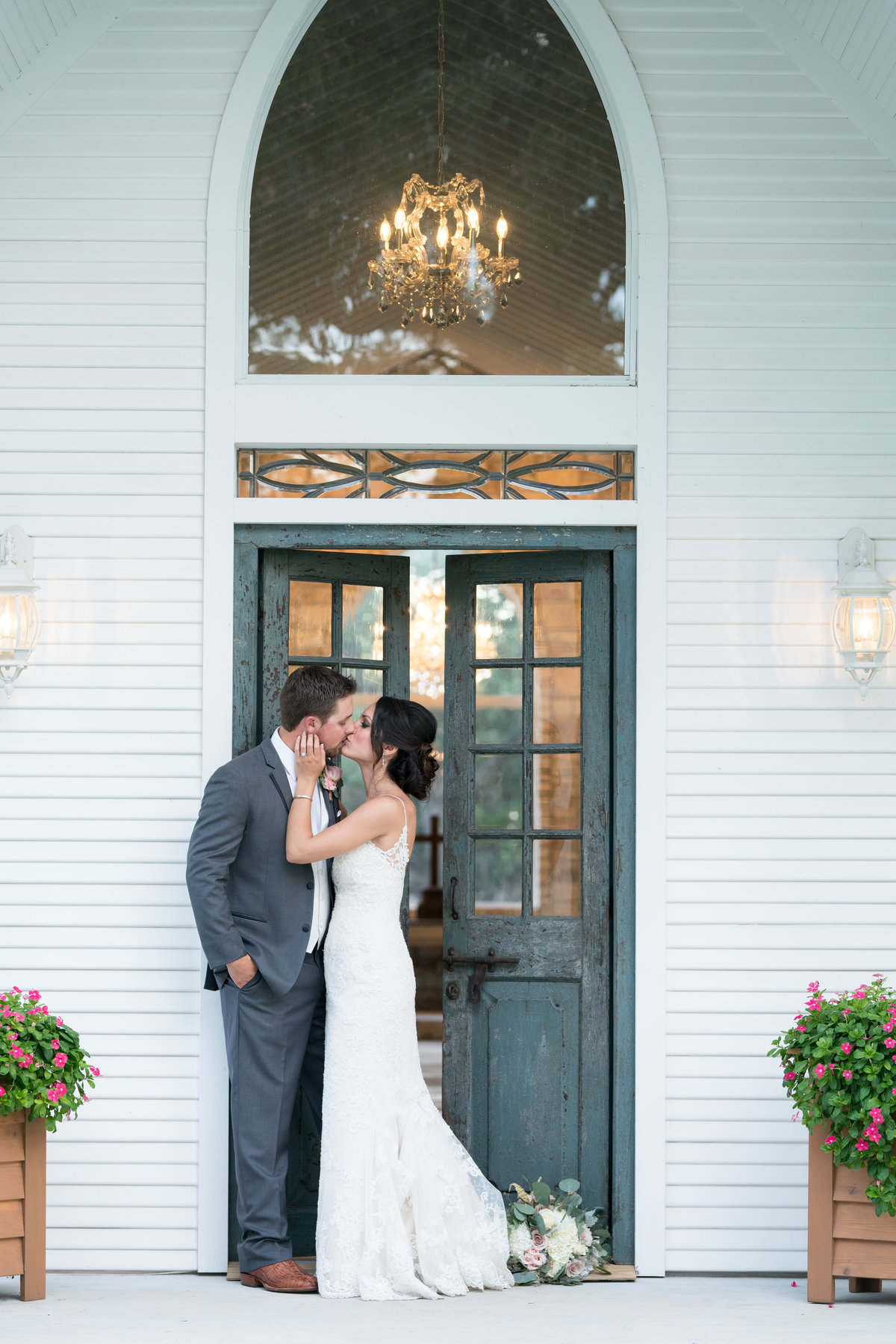 Austin wedding photographer chandelier of gruene bride groom full length
