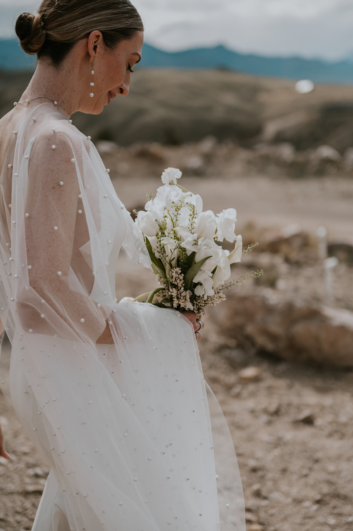Wedding dress bridal and spa nontraditional, veil, destination, elopement in Wyoming near Yellowstone bouquet