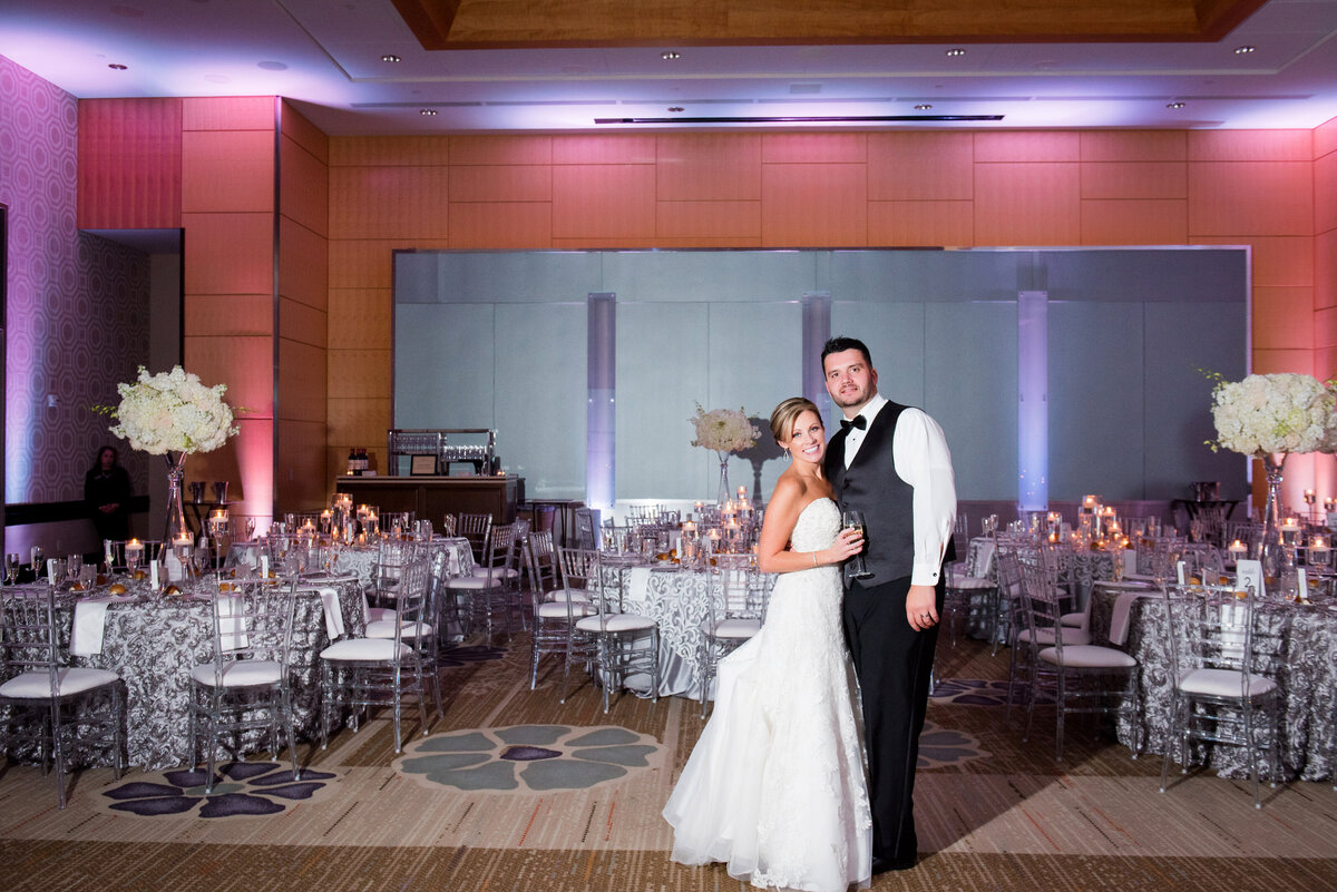 wedding reception at fairmont hotel with bride and groom smiling in the ballroom