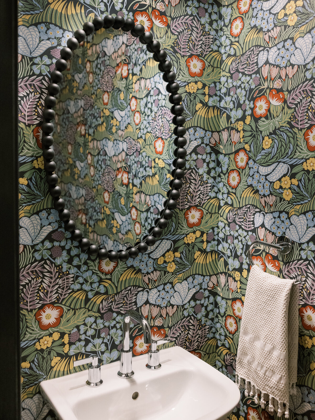 Floral powder room vibes with a dark side