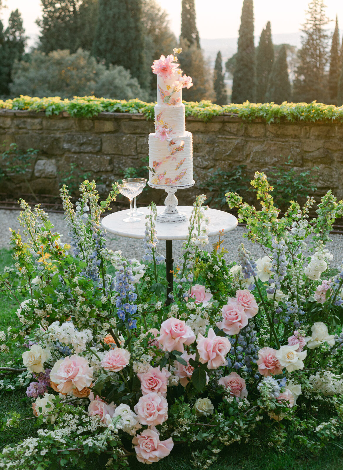 wedding cake and floral arrangement