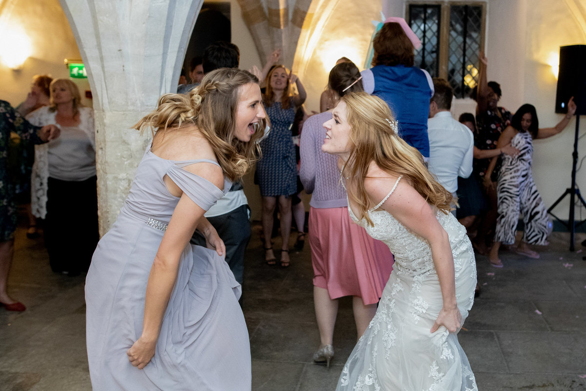 Bride and Bridesmaid dancing at Forde Abby wedding in Somerset