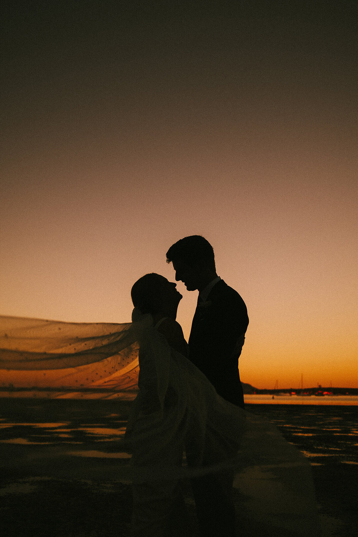 A dreamy sunset wedding portrait taken by Eilish Burt