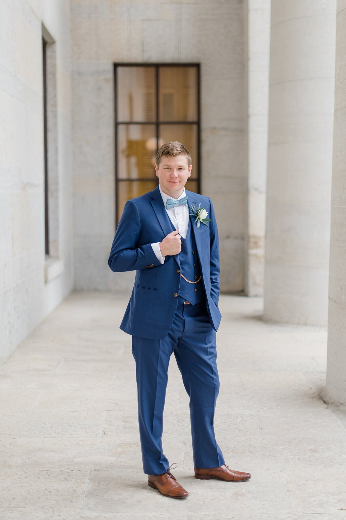 Groom poses at Ohio State House taken by ohio wedding photographer