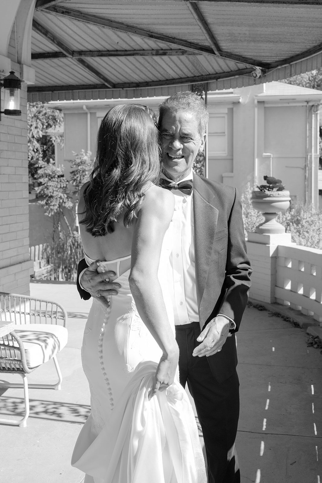 Intimate moment of bride and father's first look outside a San Antonio estate wedding venue