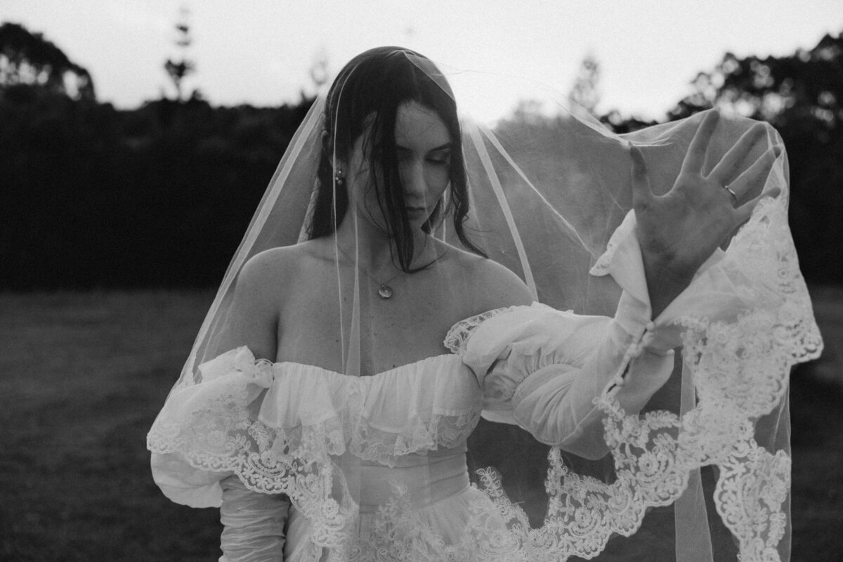Black and white emotive image using motion blur of a couple running during wedding portraits, Sunshine coast