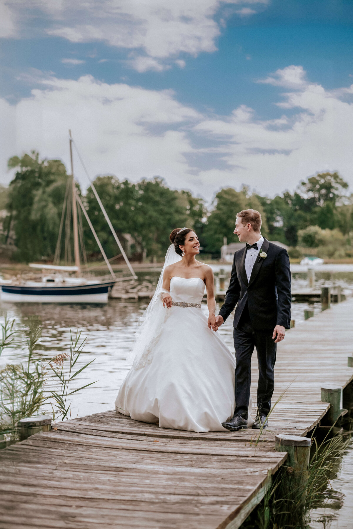 bride-and-groom-walking-on-dock