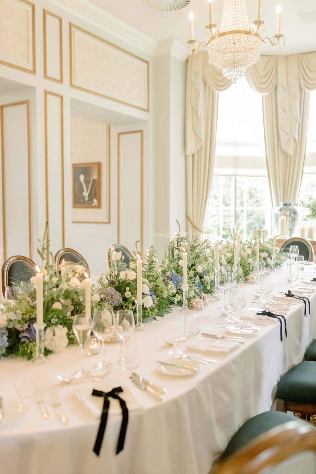 Wedding table with taper candles and florals by Wild Burnett at Gleneagles on an intimate black tie wedding day. Image by luxury fine art wedding photographer, Jill Cherry Porter.