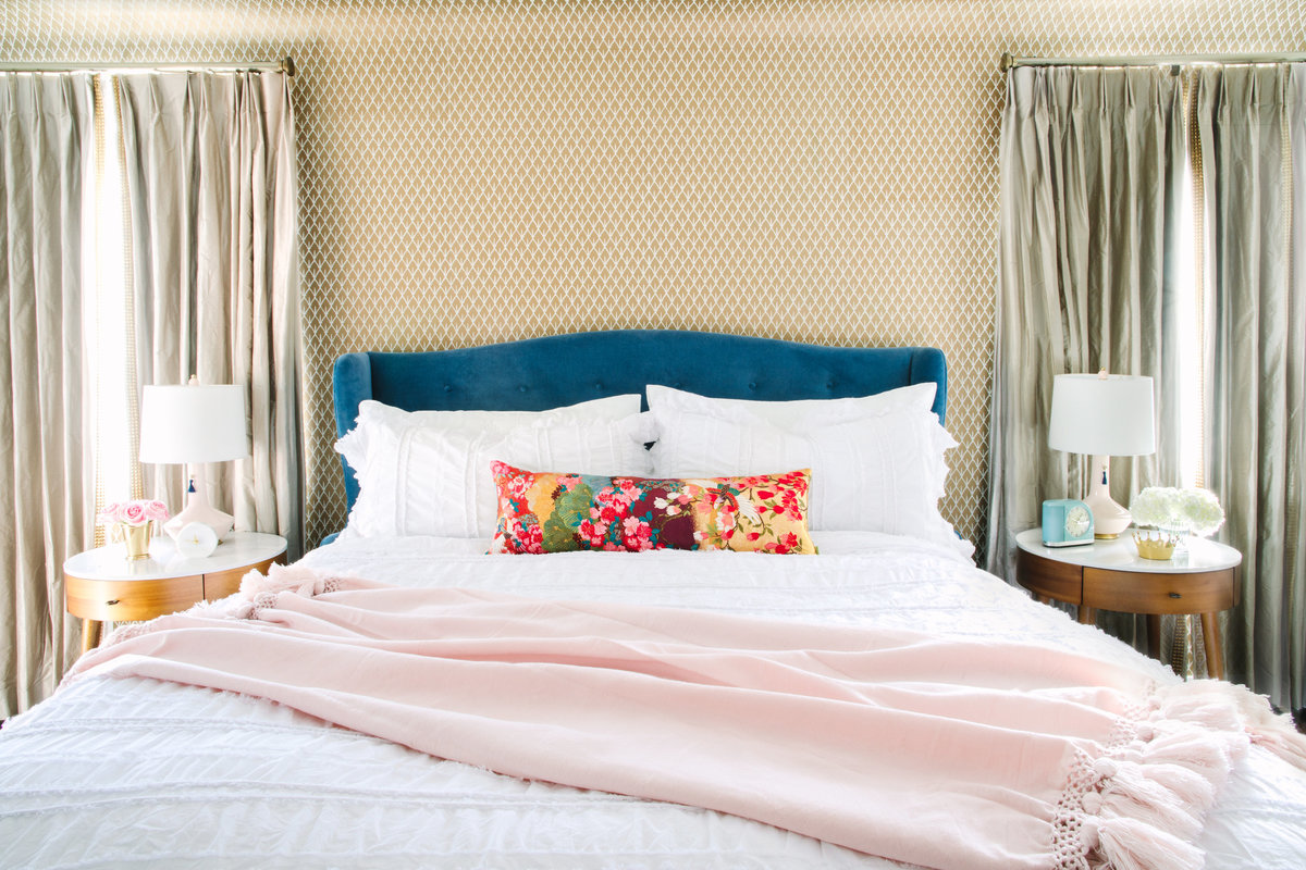 Primary bedroom with Schumacher Mughal Leaf  wallpaper, blue velvet bed, and West Elm Penelope nightstands