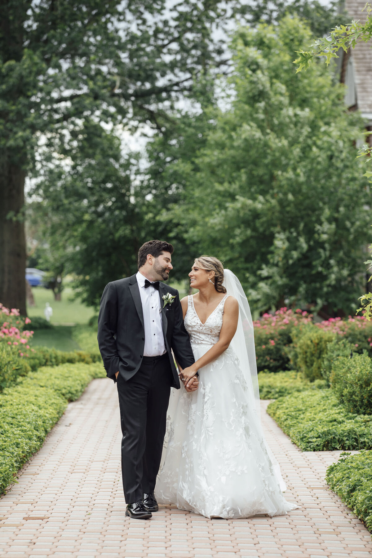 ryland-inn-spring-wedding-photo-bride-groom-walking-hand-in-hand-whitehouse-station-new-jersey