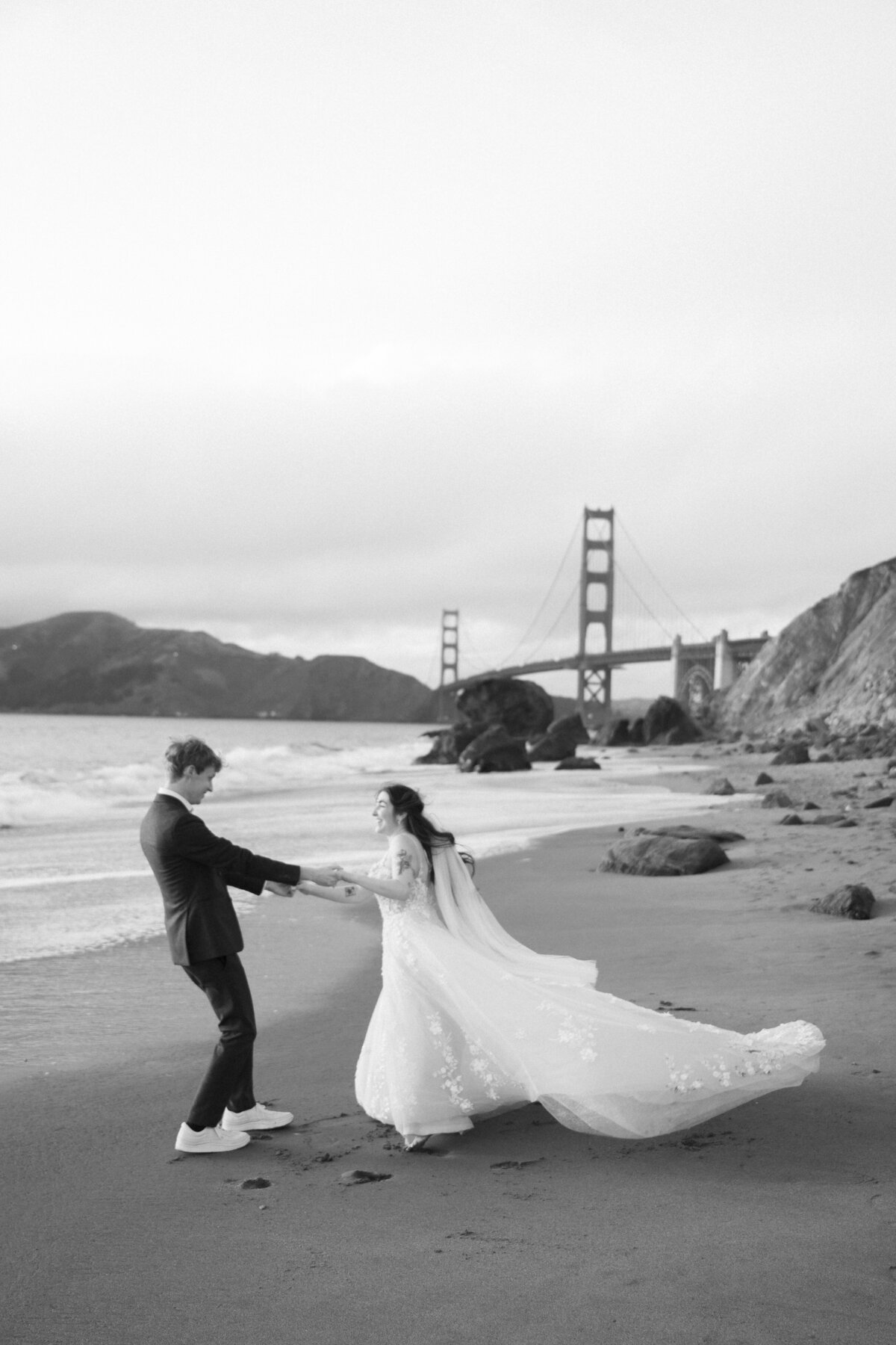 Bride and Groom at Marshall's Beach in San Francisco, California at sunset