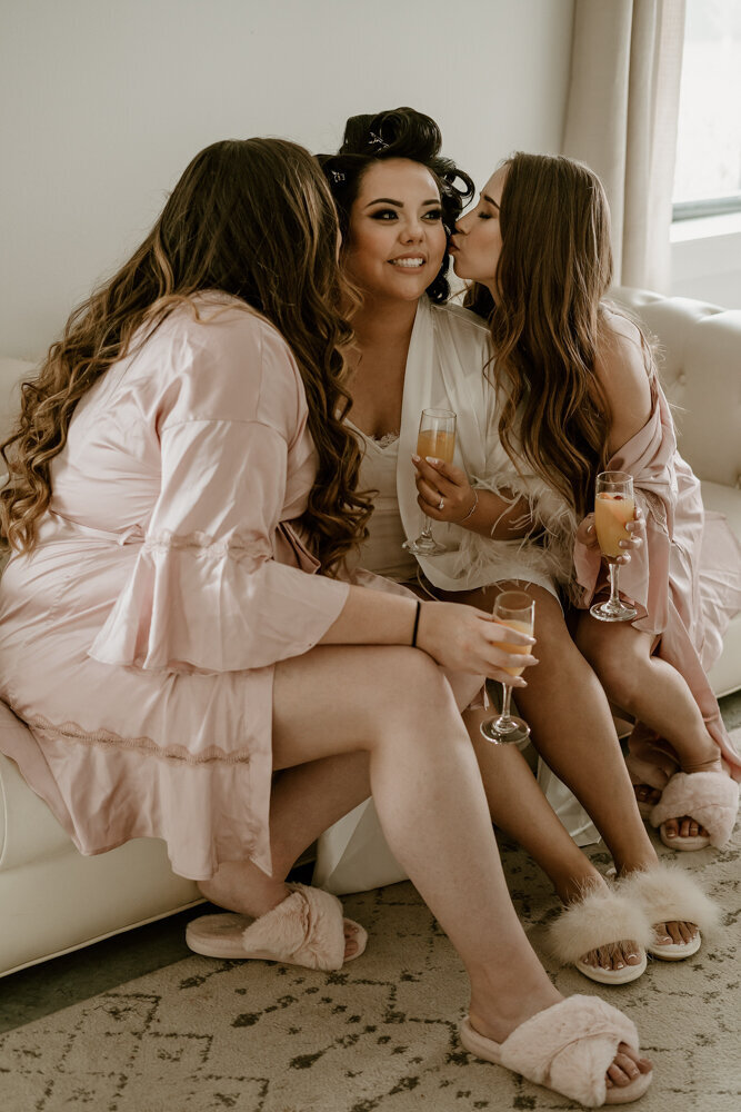 bride-getting-ready-champagne-toast-ashton-hill-farm-cedar-rapids-iowa-storyteller-collective-photo-co