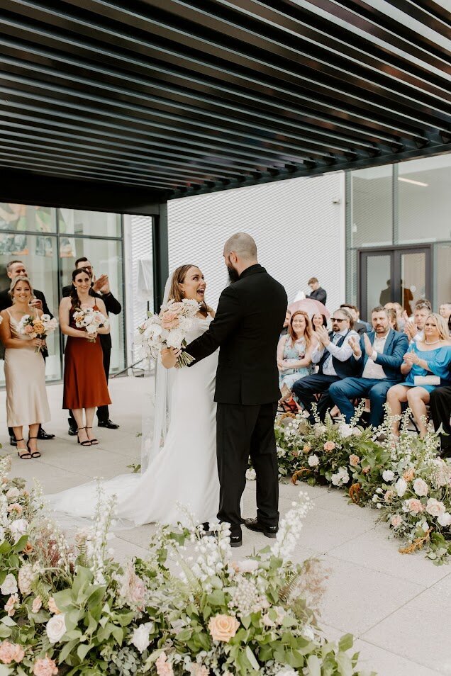 Outdoor Wedding Ceremony Under Black Pergola at OAG