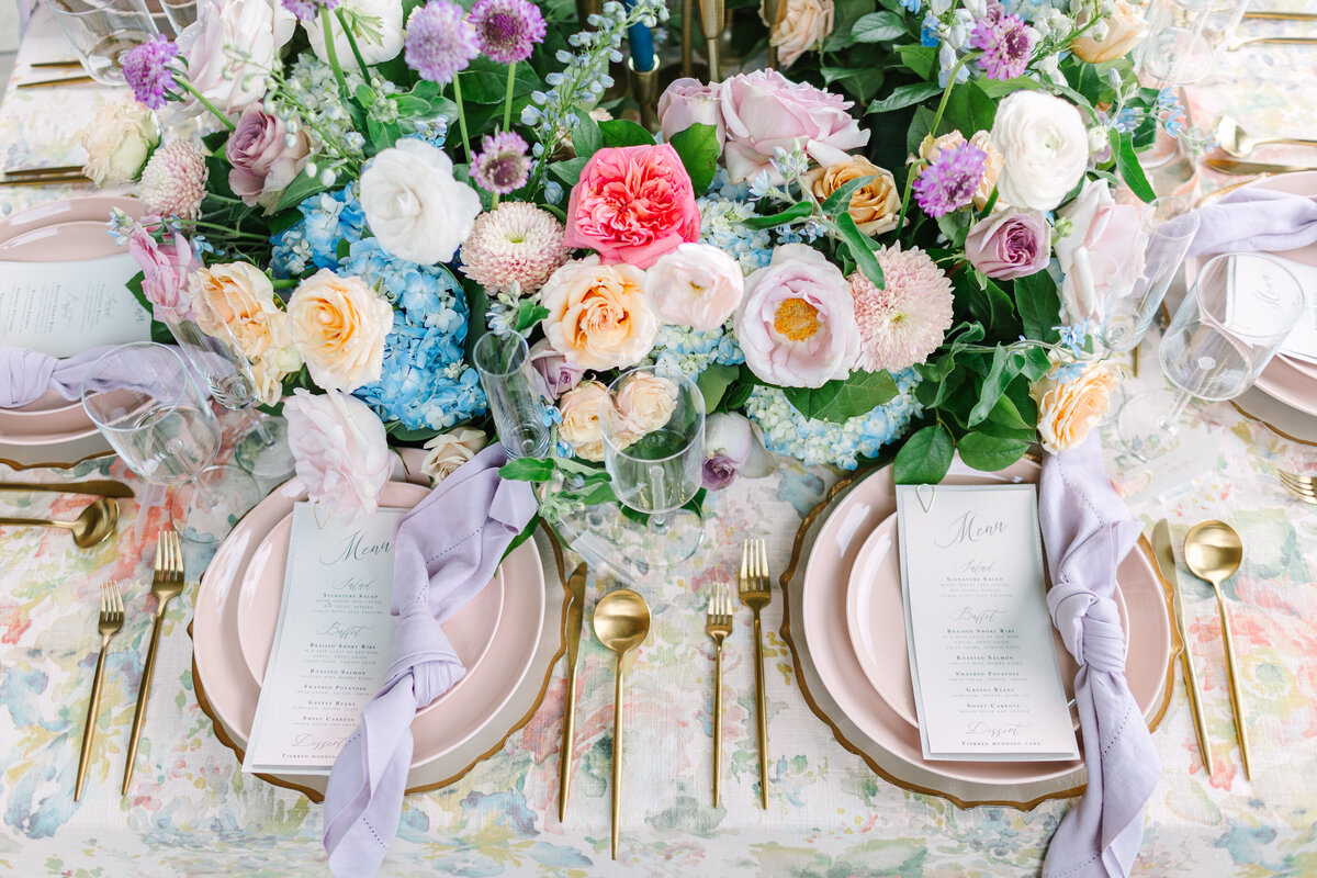 Reception table with beautiful florals and place settings