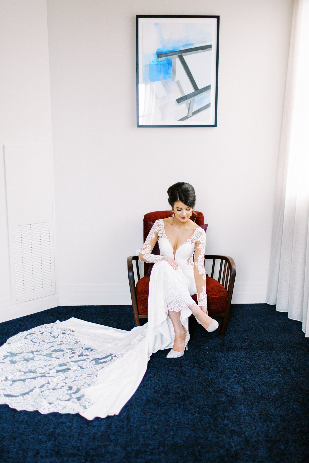 Bride is putting on her shoes in Minneapolis