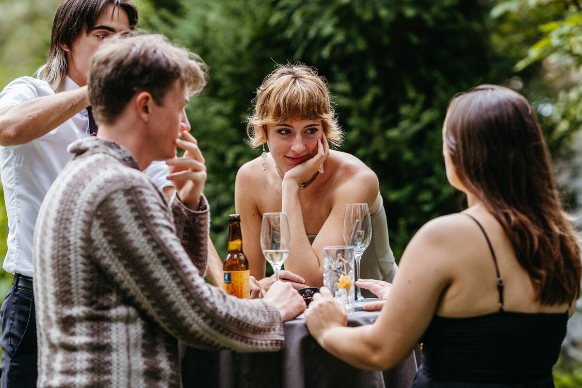Wedding guests enjoying cocktails outdoors