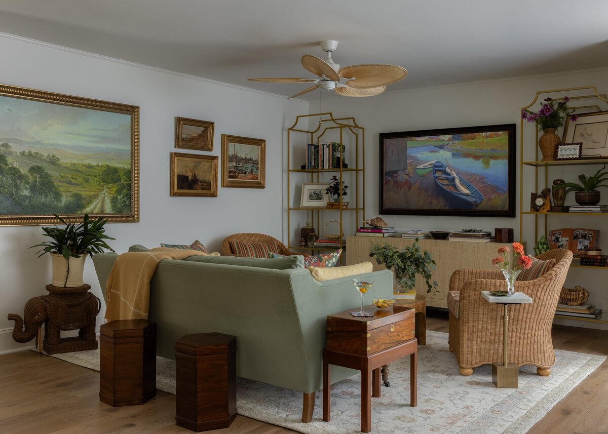 melinda chesson interiors poindexter living room with gold framed picture frames on wall and green sofa