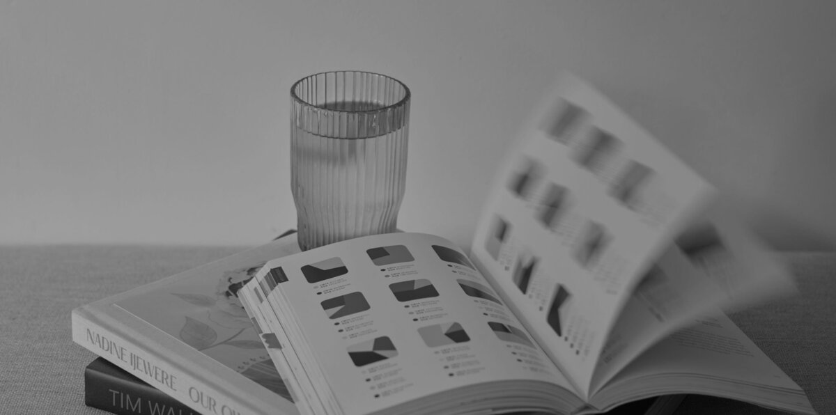 Stacked books with pages of top book flicking