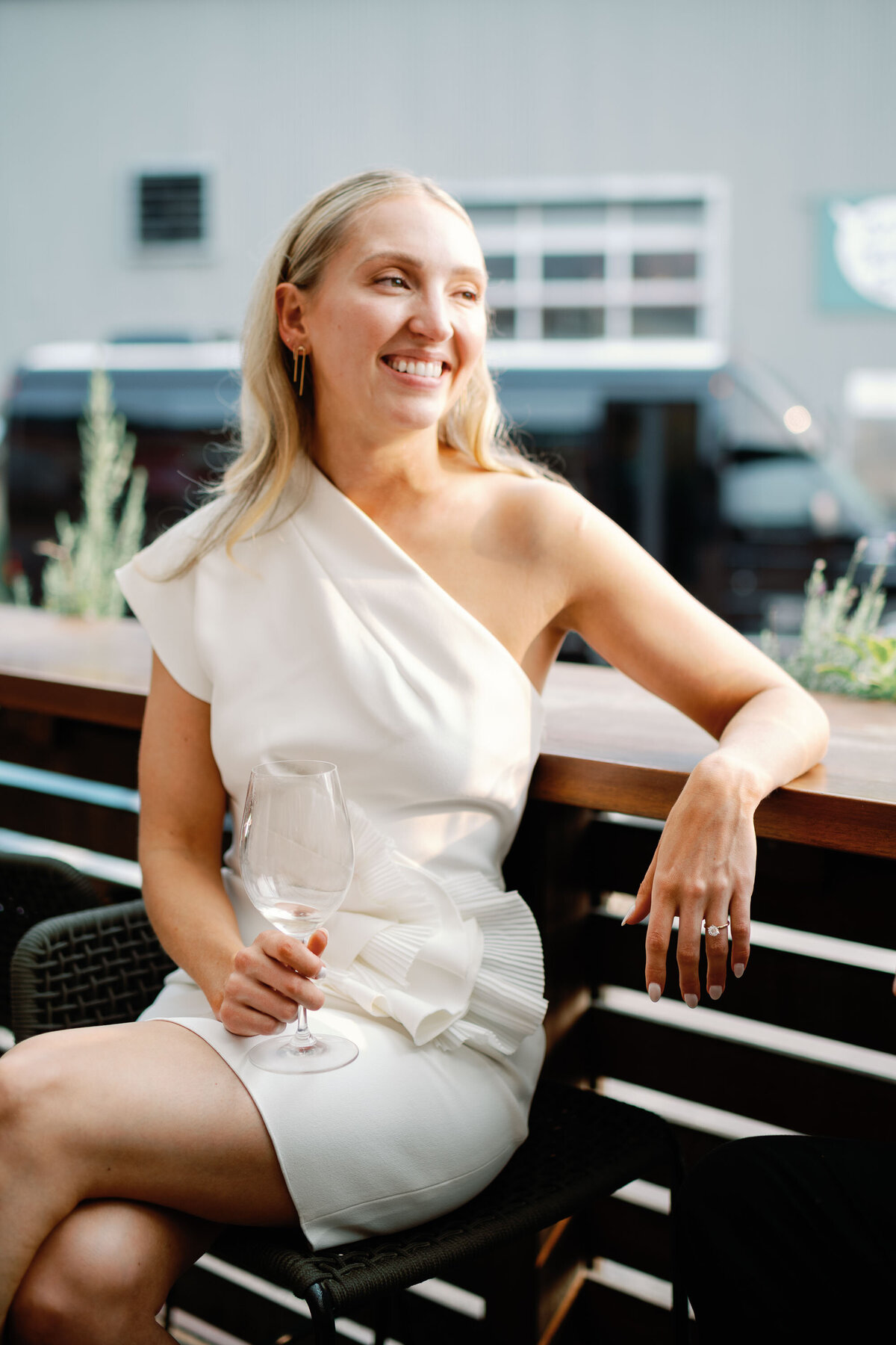 bride in chic outfit at welcome drinks at burlington vt wedding