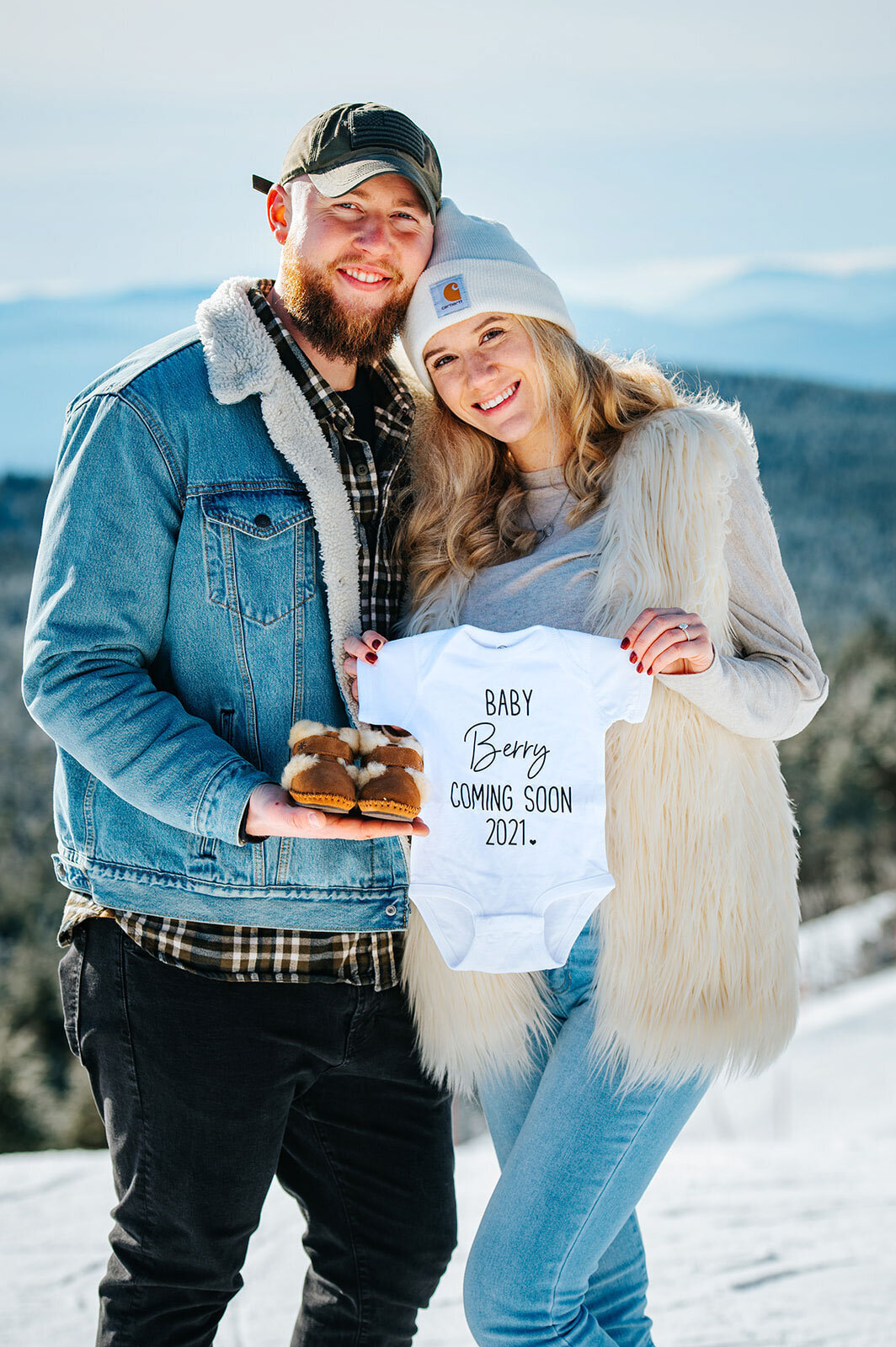 maternity announcement killington vermont mountain winter snow onesie baby booties