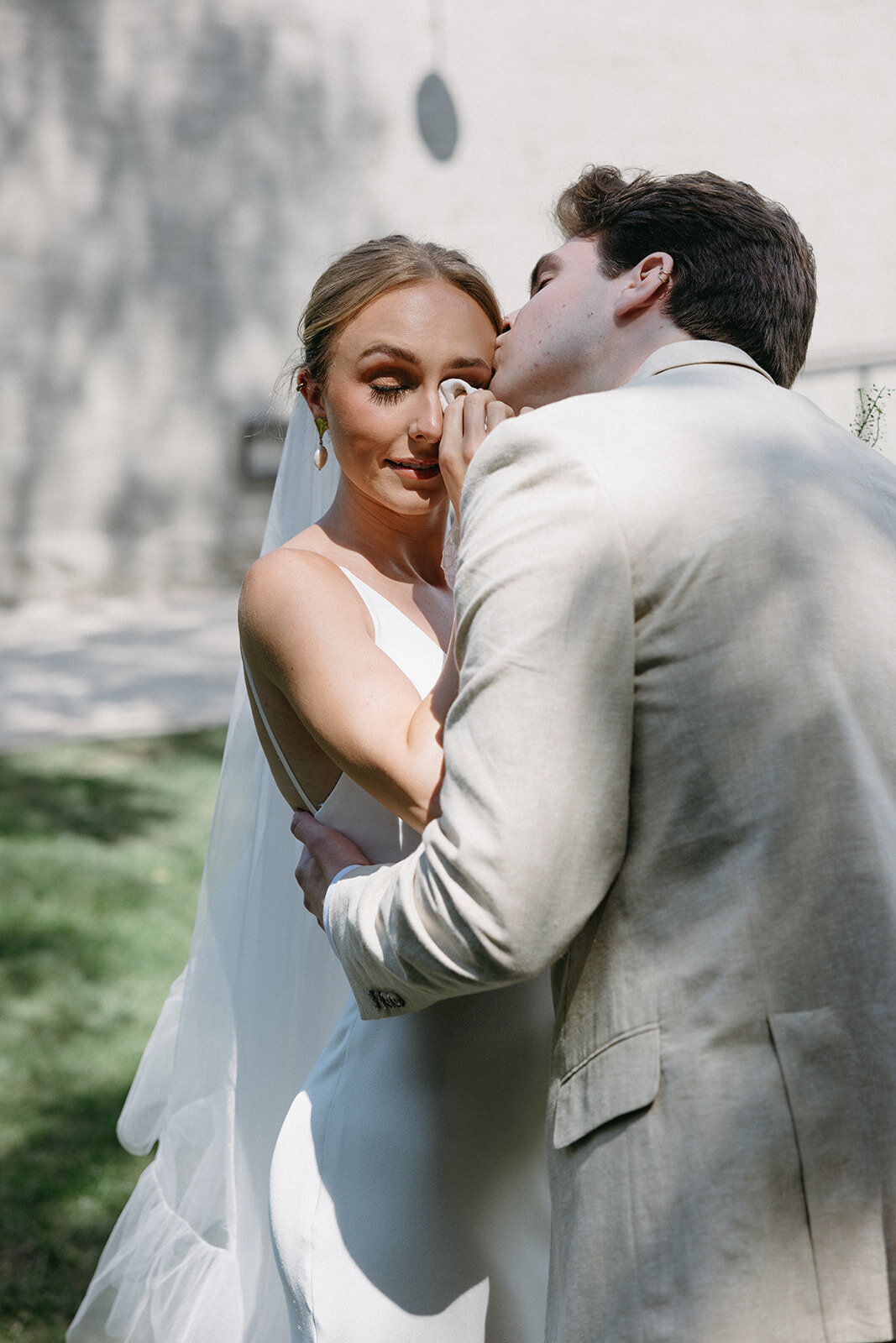 Bride wipes tears from her eyes during private vows with her groom shot by Nashville, TN wedding photographer. 