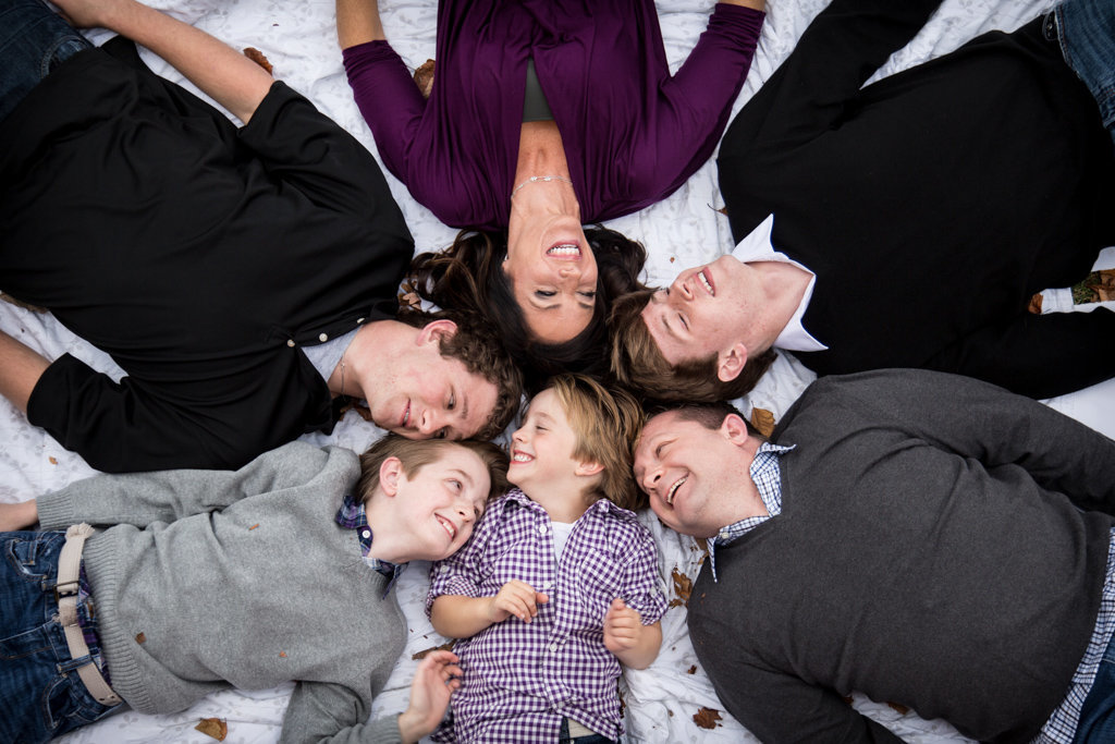 Family Laying on Ground for Family Picture