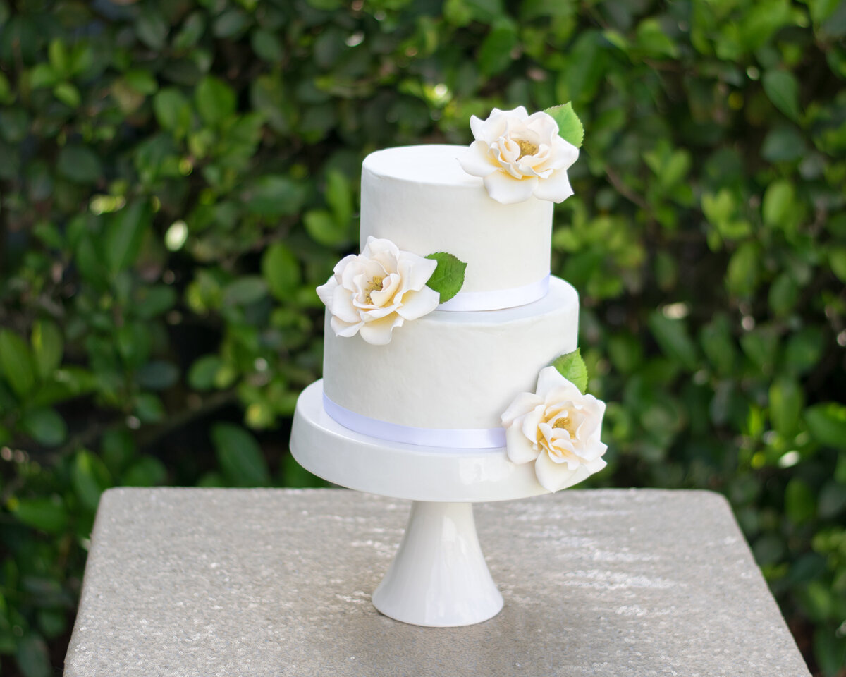 two tier cake with ivory heirloom roses
