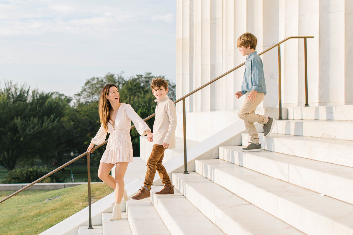 mother walking with two children down lincoln memorial steps