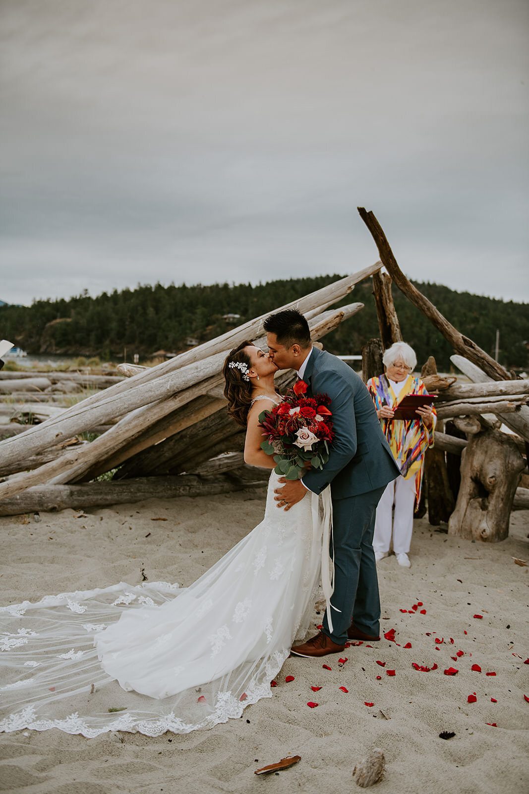 Couple during their ceremony on B.C's tropical Thormanby Island off of the Sunshine Coast.
