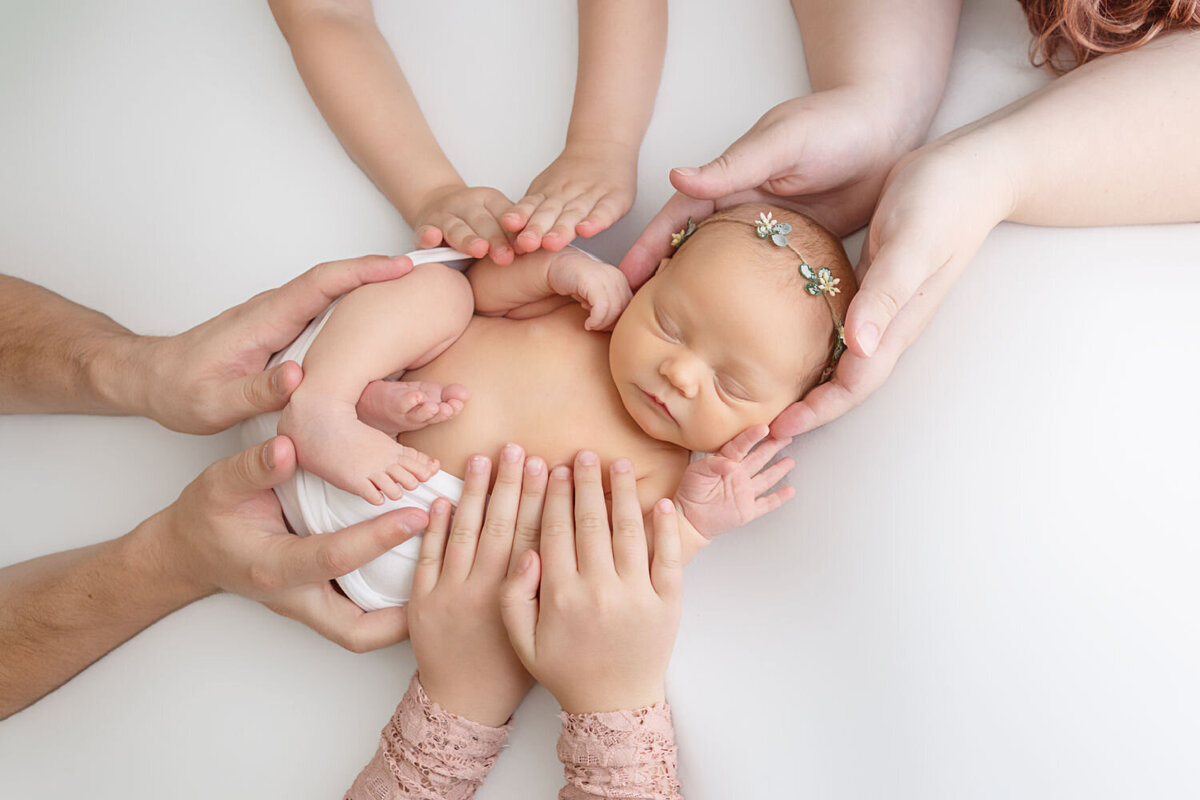 newborn in hands