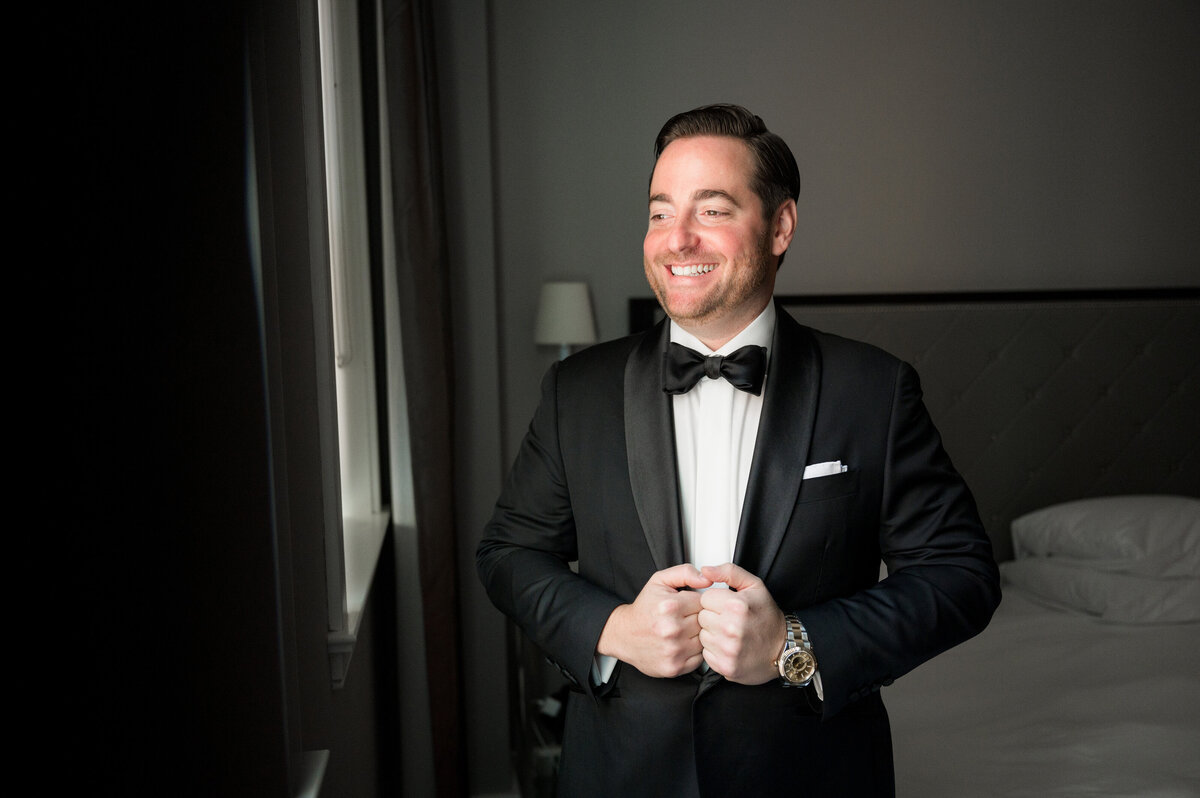 groom in window light
