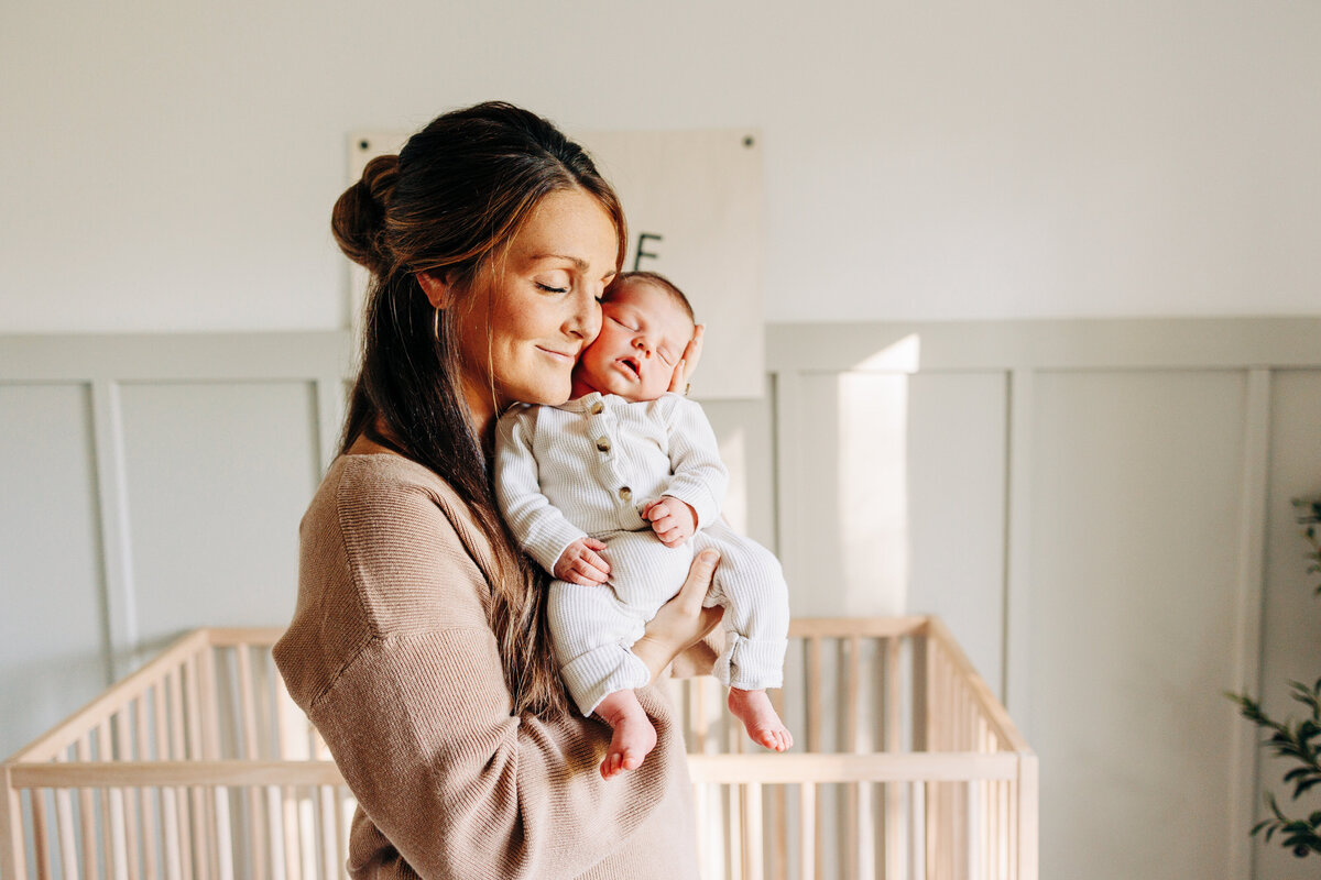 mother holding her newborn baby