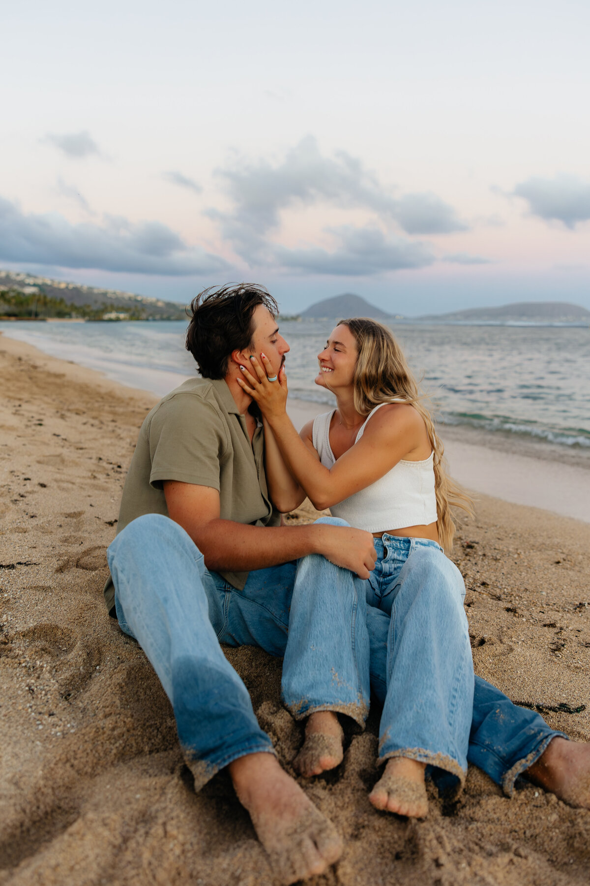 Romantic sunset couples photos captured at a beach in Honolulu, Hawaii