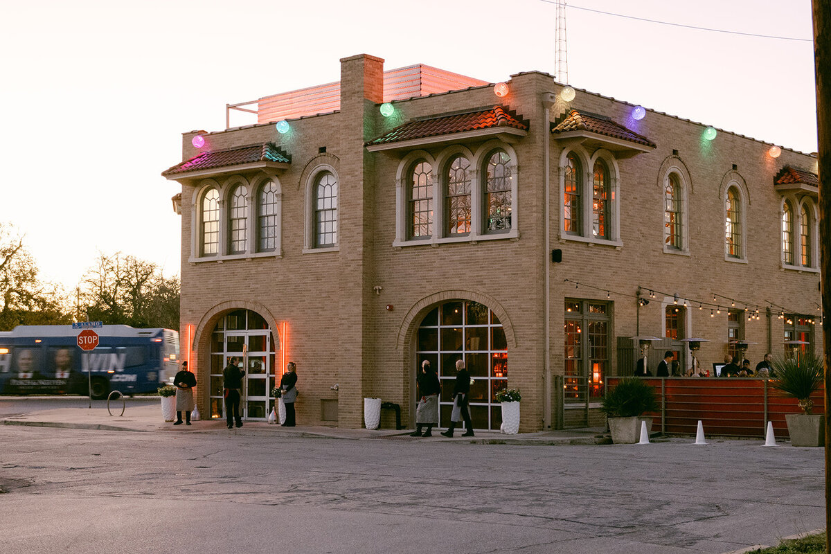 Golden hour exterior of The Battalion, a restored firehouse turned luxury wedding venue in San Antonio