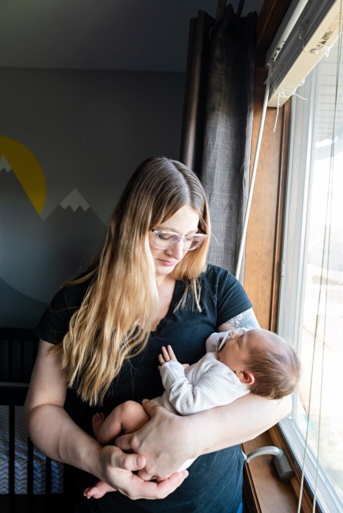 mom holding newborn boy