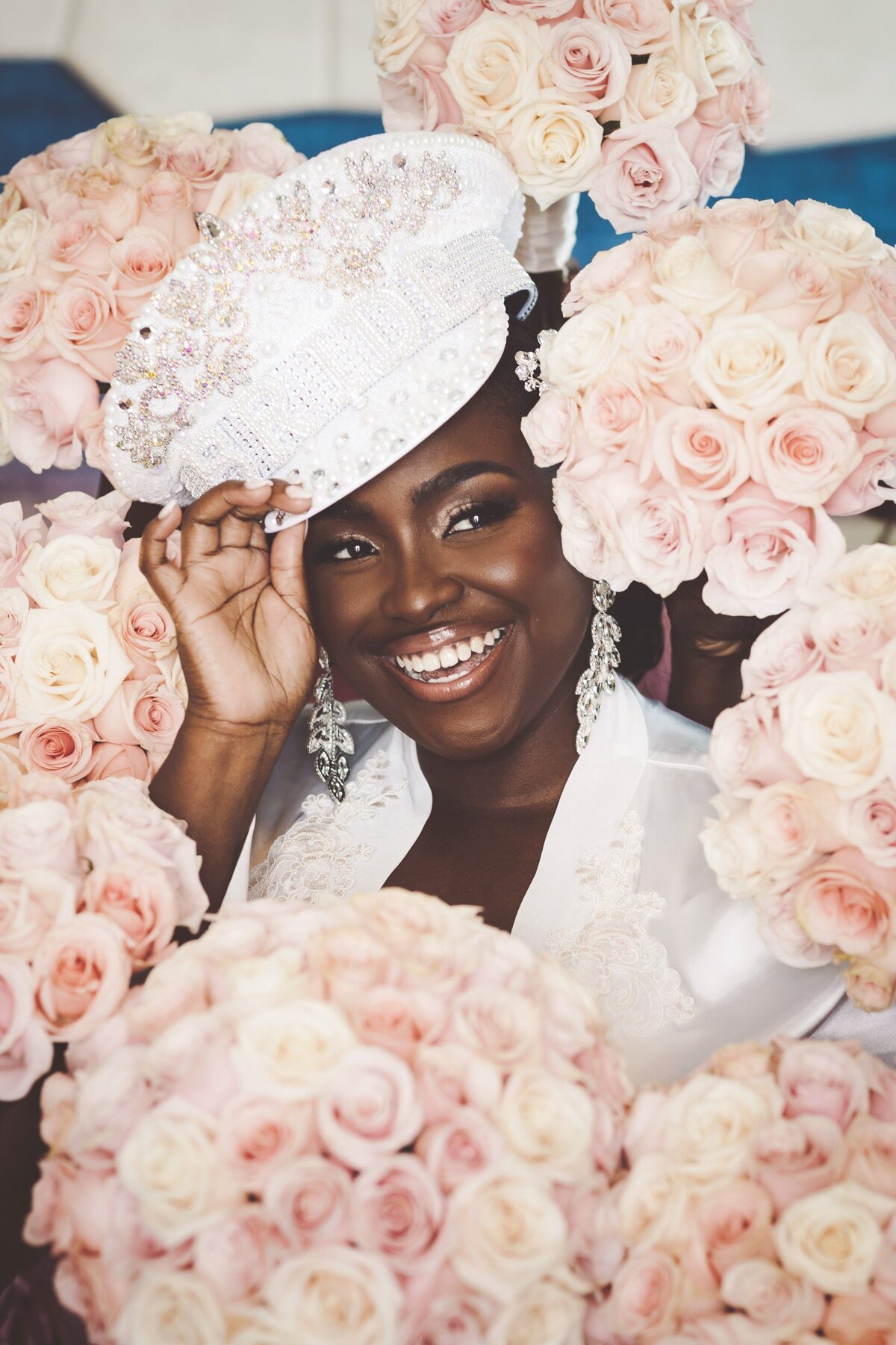 Bride surrounded by bouquets at wedding in Cancun